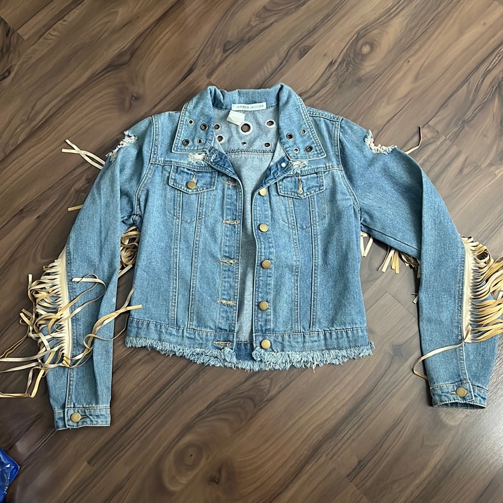 NWT. Denim jacket with fringes.
